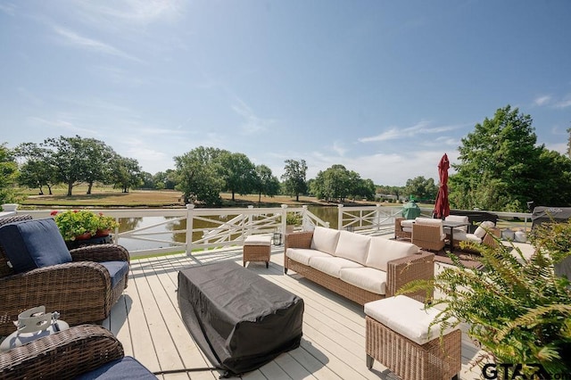 wooden deck with an outdoor living space