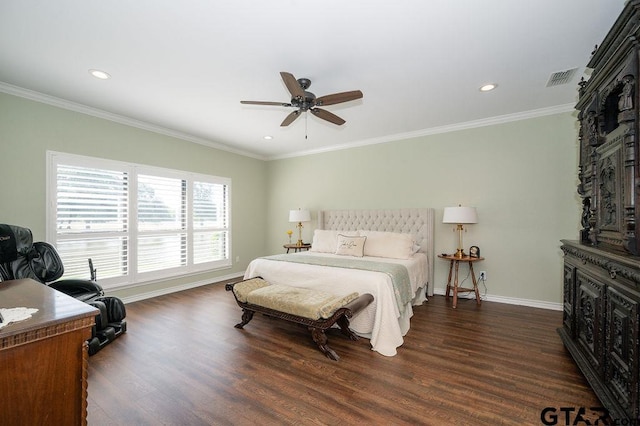 bedroom with visible vents, crown molding, baseboards, and wood finished floors