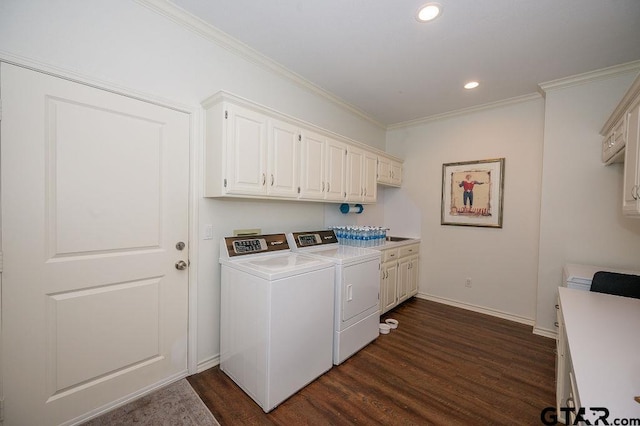 clothes washing area with ornamental molding, washer and dryer, recessed lighting, cabinet space, and dark wood-style flooring