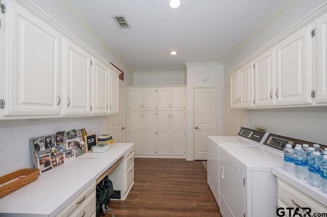 laundry room with visible vents, crown molding, separate washer and dryer, cabinet space, and dark wood-style flooring