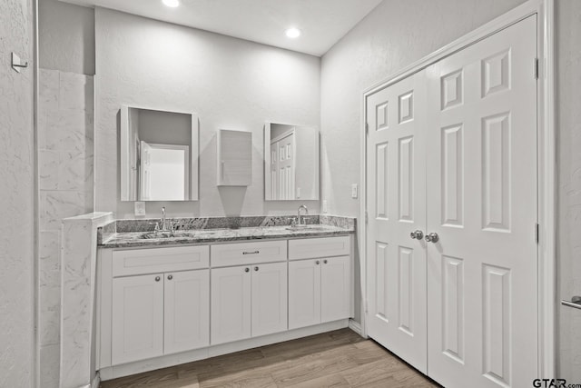 bathroom featuring vanity and wood-type flooring