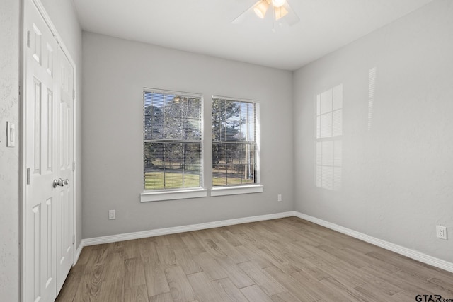 unfurnished bedroom featuring a closet, ceiling fan, and light hardwood / wood-style flooring