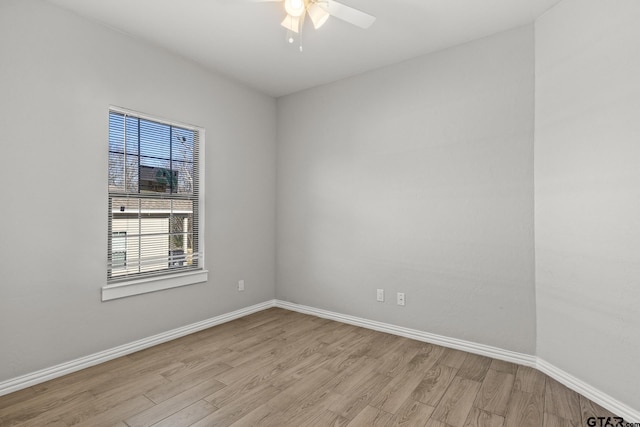 empty room featuring ceiling fan and light hardwood / wood-style flooring