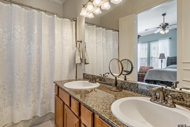 bathroom featuring ceiling fan, vanity, and crown molding