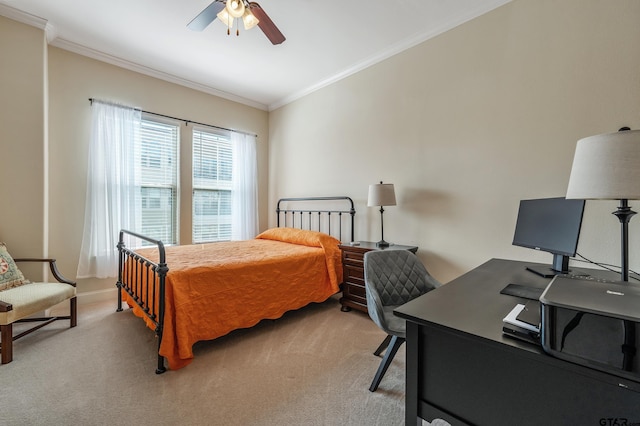 carpeted bedroom with ceiling fan and crown molding