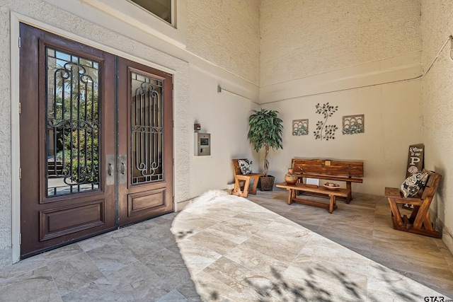 doorway to property with a patio area and french doors