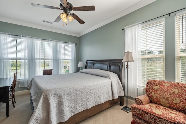 bedroom with light carpet, ceiling fan, and crown molding