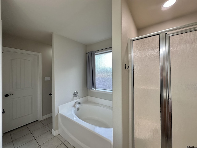 2509 Guinn Farms Rd, Tyler, TX 75707 - bathroom with tile patterned flooring, a bath, and a stall shower