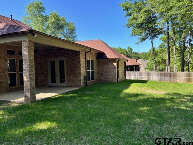 3673 Southwood Dr, Tyler, TX 75707 - view of yard featuring french doors, fence, and a patio
