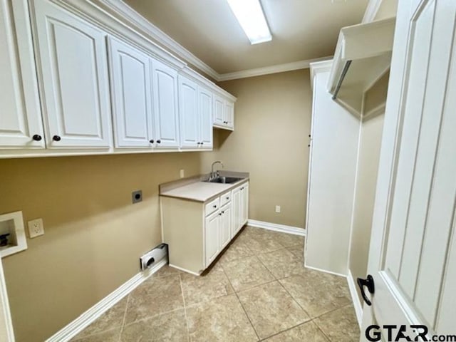 3673 Southwood Dr, Tyler, TX 75707 - clothes washing area featuring cabinet space, a sink, electric dryer hookup, baseboards, and ornamental molding