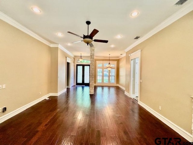 3673 Southwood Dr, Tyler, TX 75707 - unfurnished living room featuring ceiling fan with notable chandelier, baseboards, dark wood-type flooring, visible vents, and ornamental molding