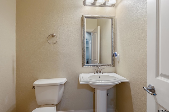 bathroom featuring toilet