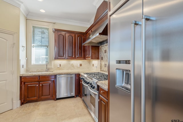 kitchen featuring light stone countertops, sink, backsplash, crown molding, and high end appliances