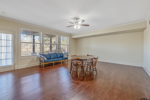 dining space featuring ceiling fan, ornamental molding, and dark wood-type flooring