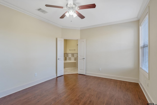 empty room with dark hardwood / wood-style floors, ceiling fan, and ornamental molding