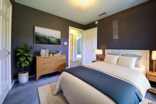 bedroom with light colored carpet