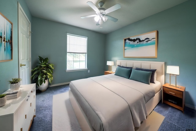 bedroom with dark colored carpet and ceiling fan