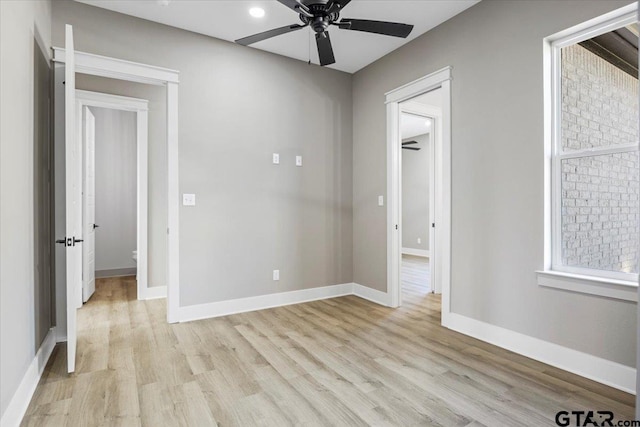 unfurnished room featuring ceiling fan and light hardwood / wood-style floors