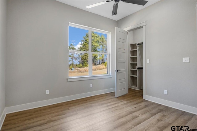 unfurnished bedroom featuring ceiling fan and light hardwood / wood-style flooring