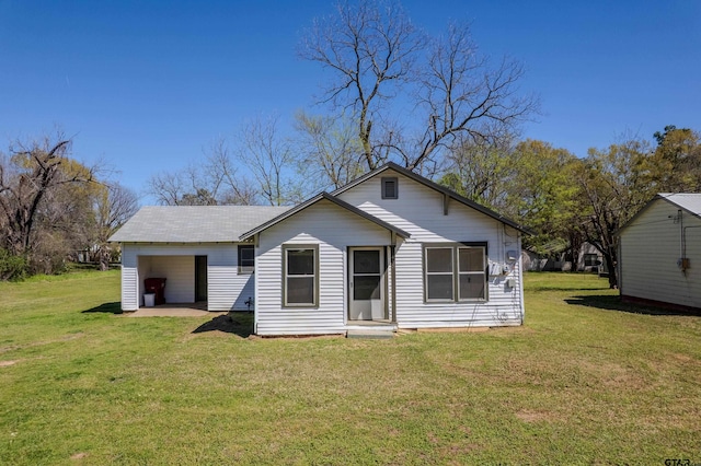 back of house with a yard