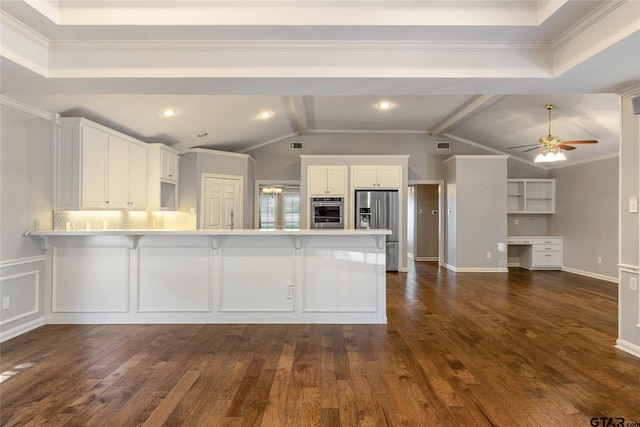 kitchen with kitchen peninsula, white cabinetry, stainless steel appliances, and lofted ceiling with beams