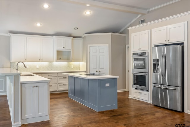 kitchen featuring white cabinets, stainless steel appliances, and sink