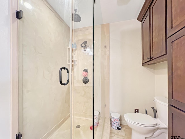 full bathroom featuring toilet and a stall shower