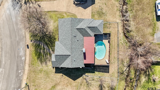view of subject property with a pool area