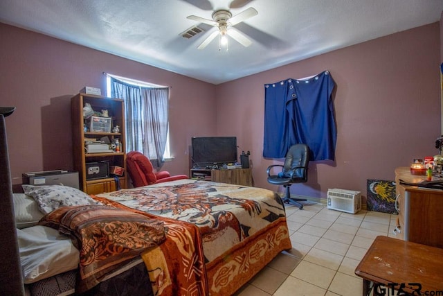 bedroom with ceiling fan and light tile patterned flooring