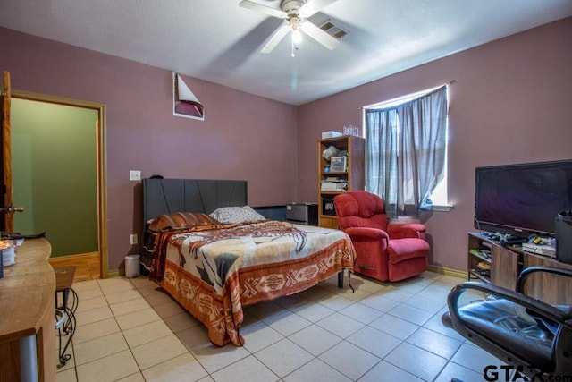 tiled bedroom with ceiling fan