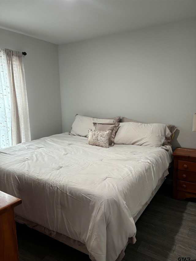 bedroom featuring dark wood-type flooring