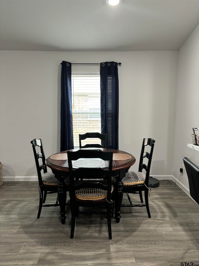 dining area with hardwood / wood-style floors