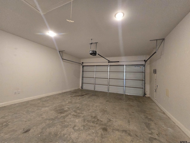 823 Lindsey Ln, Whitehouse, TX 75791 - garage featuring baseboards and a garage door opener