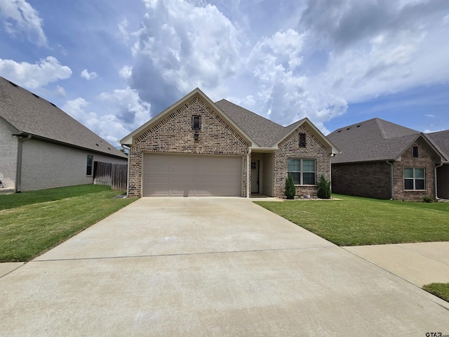823 Lindsey Ln, Whitehouse, TX 75791 - view of front of house with brick siding, driveway, a garage, and roof with shingles