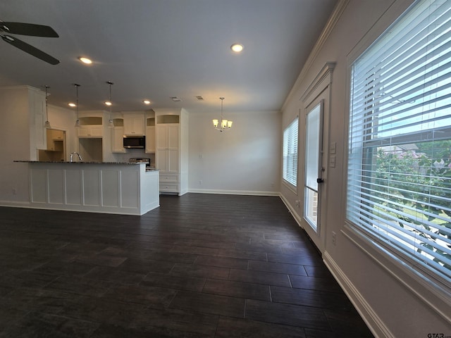 823 Lindsey Ln, Whitehouse, TX 75791 - unfurnished living room featuring a chandelier, ceiling fan, recessed lighting, ornamental molding, and dark wood-type flooring