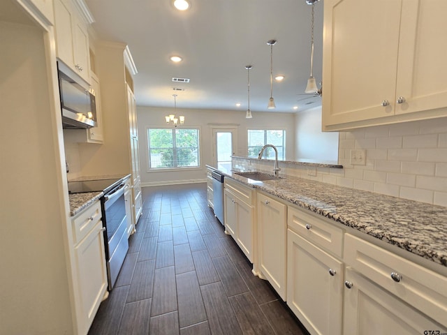 823 Lindsey Ln, Whitehouse, TX 75791 - kitchen featuring appliances with stainless steel finishes, white cabinets, recessed lighting, decorative backsplash, and a chandelier