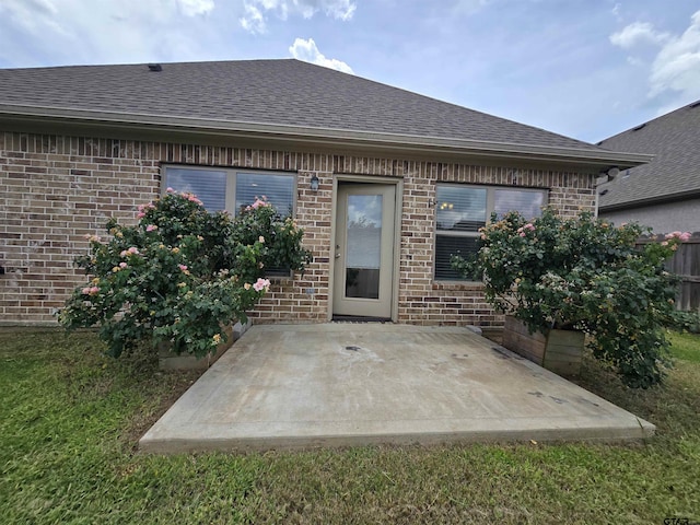 823 Lindsey Ln, Whitehouse, TX 75791 - back of house featuring brick siding and roof with shingles