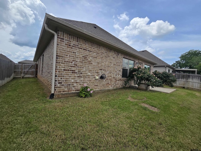823 Lindsey Ln, Whitehouse, TX 75791 - view of home's exterior featuring brick siding, a fenced backyard, a patio area, and roof with shingles