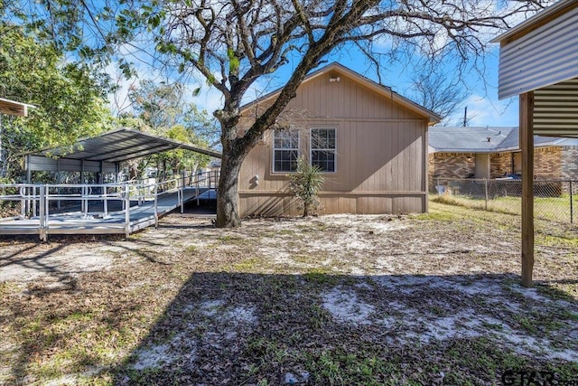 view of home's exterior with a carport