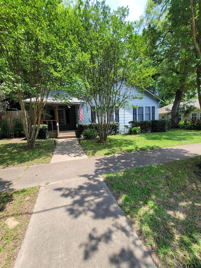 view of front of property with a front lawn