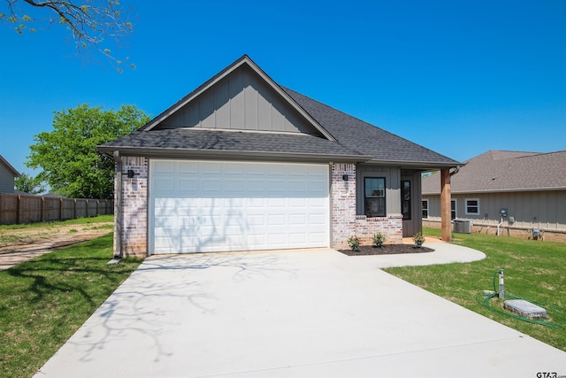 216 Nolan Farms Blvd, Winona, TX 75792 - view of front of home featuring brick siding, board and batten siding, concrete driveway, and a garage