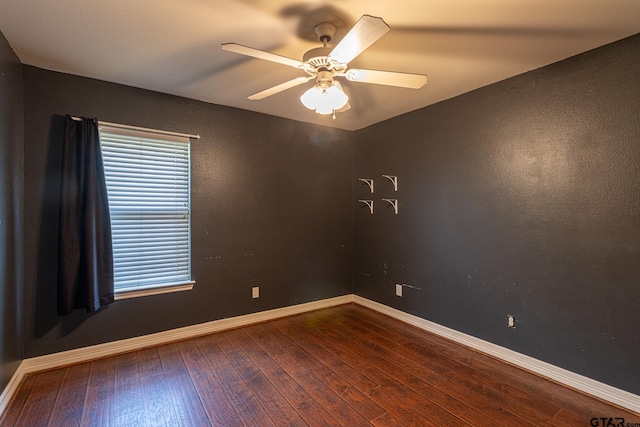 empty room featuring hardwood / wood-style flooring and ceiling fan