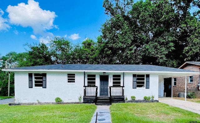 single story home with a carport, covered porch, and a front yard