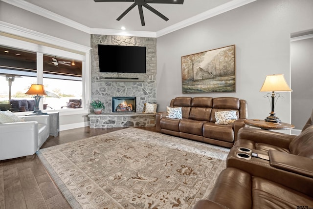 21562 Castle Rock Cir, Bullard, TX 75757 - living room featuring a ceiling fan, ornamental molding, a fireplace, wood finished floors, and baseboards