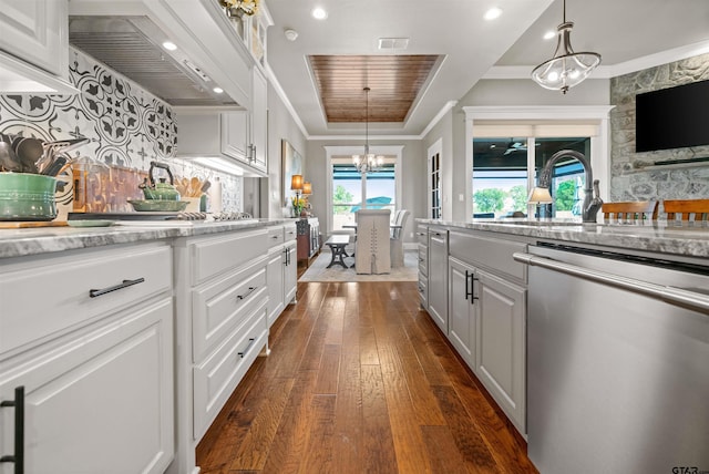 21562 Castle Rock Cir, Bullard, TX 75757 - kitchen featuring stainless steel dishwasher, premium range hood, dark wood finished floors, a sink, and white cabinetry