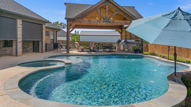 21562 Castle Rock Cir, Bullard, TX 75757 - view of pool featuring a gazebo, exterior kitchen, a fenced backyard, a patio area, and a pool with connected hot tub