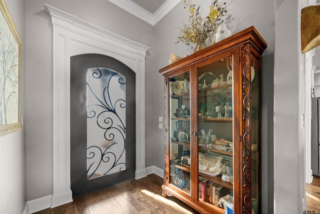 21562 Castle Rock Cir, Bullard, TX 75757 - foyer with ornamental molding, wood finished floors, arched walkways, and baseboards