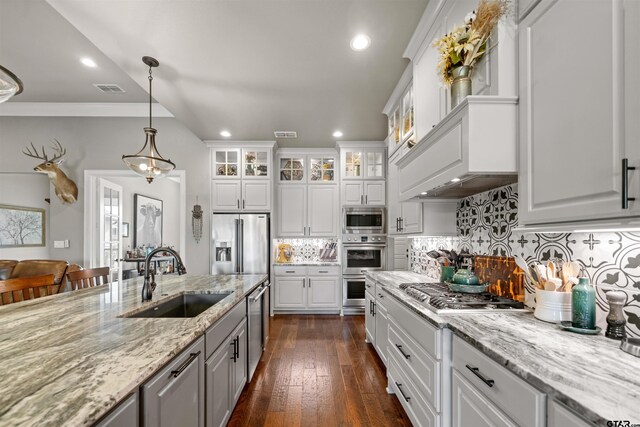 21562 Castle Rock Cir, Bullard, TX 75757 - kitchen with a sink, stainless steel appliances, white cabinets, recessed lighting, and glass insert cabinets