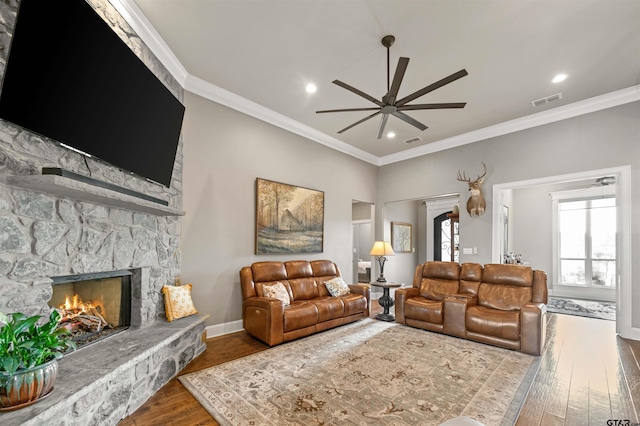 21562 Castle Rock Cir, Bullard, TX 75757 - living area with a ceiling fan, a fireplace, ornamental molding, wood finished floors, and baseboards