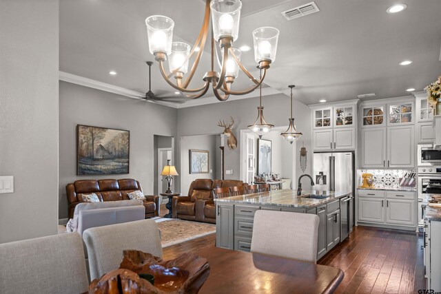 21562 Castle Rock Cir, Bullard, TX 75757 - kitchen featuring open floor plan, stainless steel appliances, light stone countertops, a chandelier, and recessed lighting